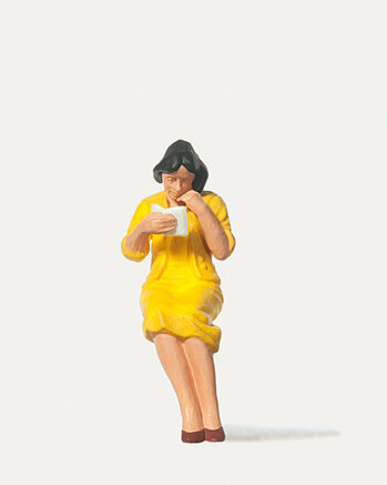 Merten 240002 - Sitzende Reisende mit Buch