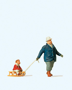 Preiser 28078 - H0 Mann mit Kind auf Schlitten